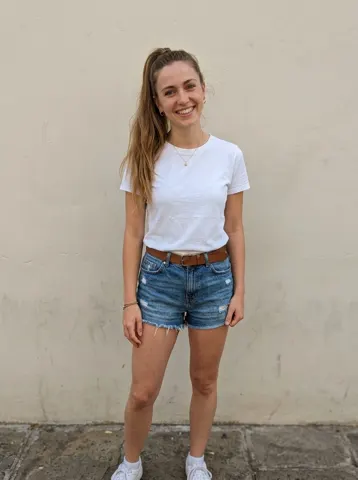 Photo of a young woman in a white t-shirt used for a Bama Bound AI video
